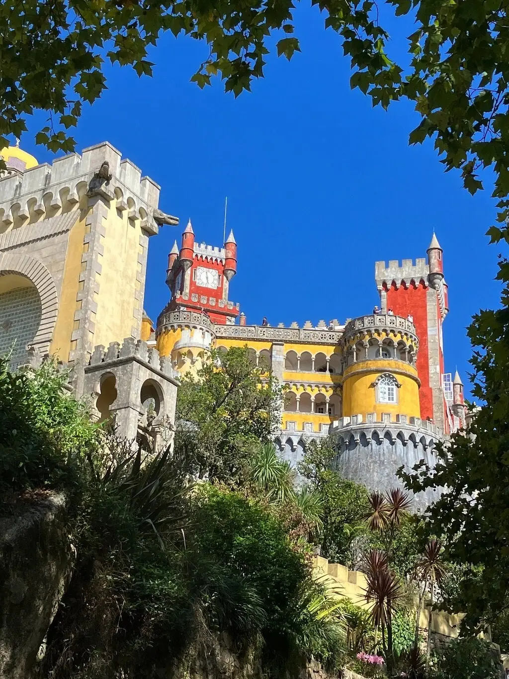 The Pena Palace rising above the trees, seen from a path in the park