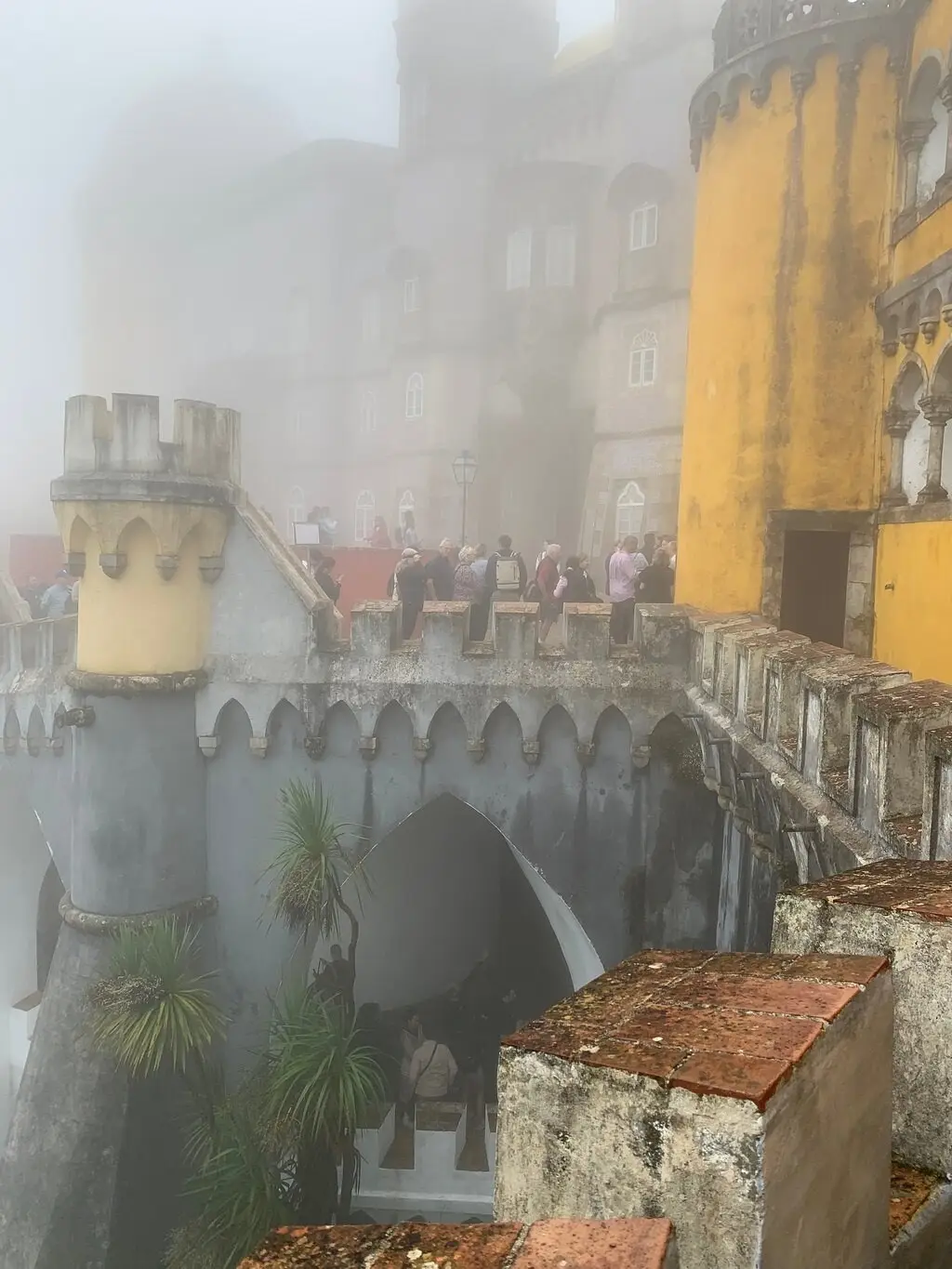The Pena terraces and yellow walls almost hidden in fog