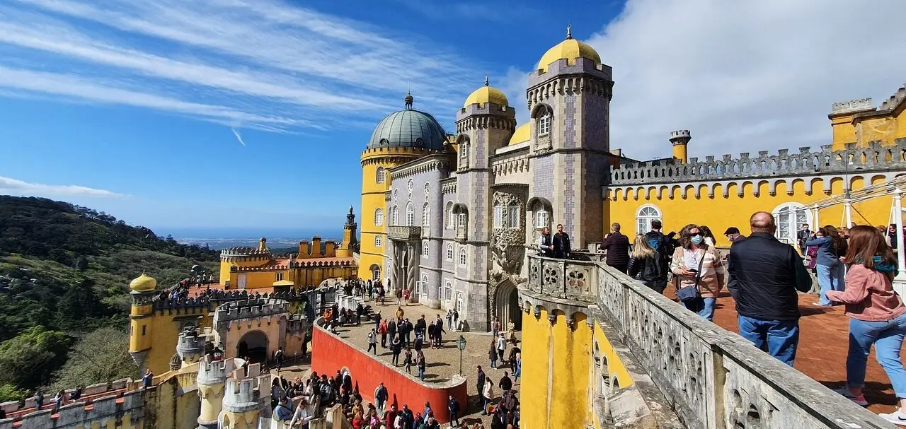 A crowded main terrace at the Pena Palace on a sunny day
