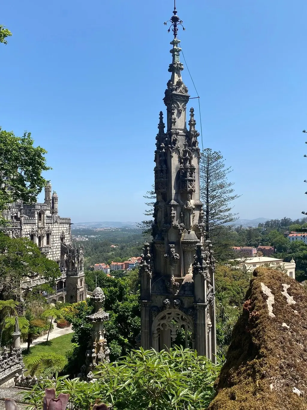 The tower of Quinta da Regaleira above its gardens and the town of Sintra